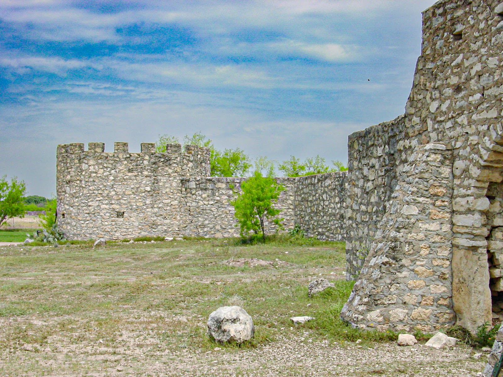 The ruins of an old fieldstone structure with an cylindrical turret.  