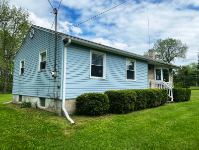 view of side and front of 136 Searles Rd
Shows bedroom windows.
