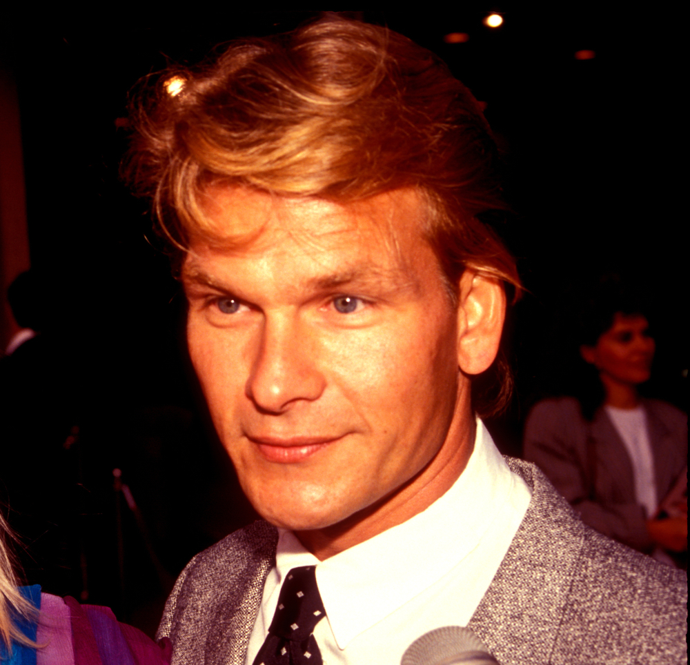 Patrick Swayze smiles for camera.