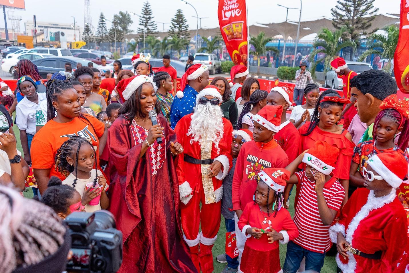 A group of people in santa clothing

Description automatically generated