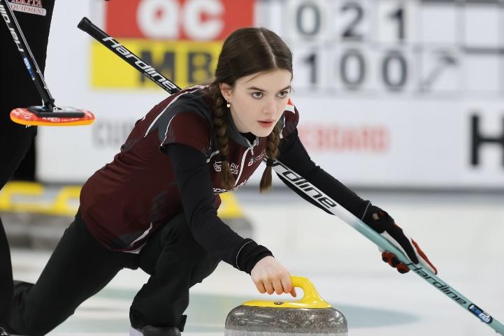 A person holding a curling stone

AI-generated content may be incorrect.