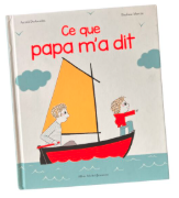 A book with a picture of two boys in a boat

Description automatically generated