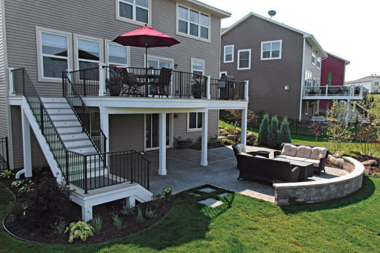 when to hire a michigan deck installer elevated decking space with furniture and dining area custom built okemos