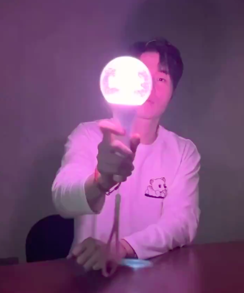 This  contain of image of Lee Dong holding Wook's light