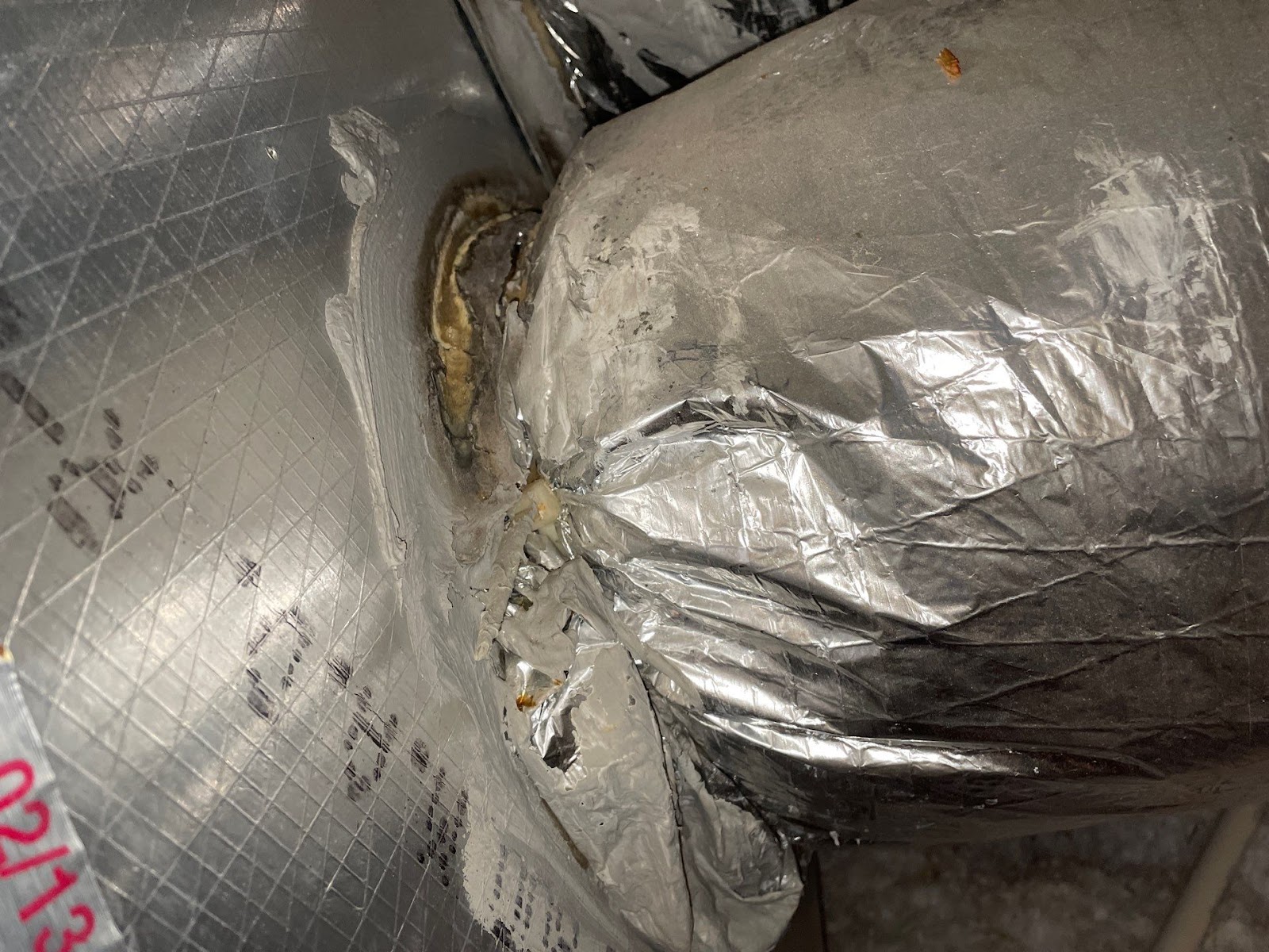 Old ductwork that is damaged at the supply plenum. 