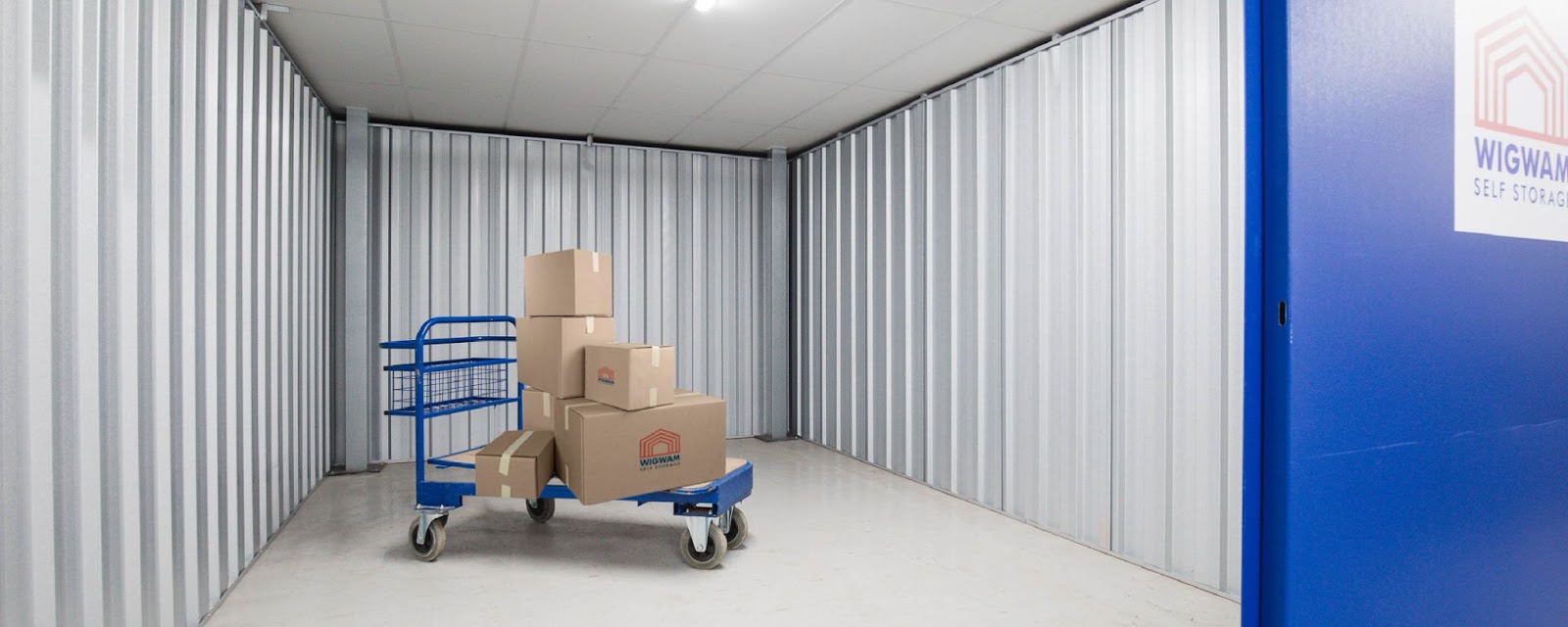 People moving boxes into a Wigwam storage facility (Bromsgrove)