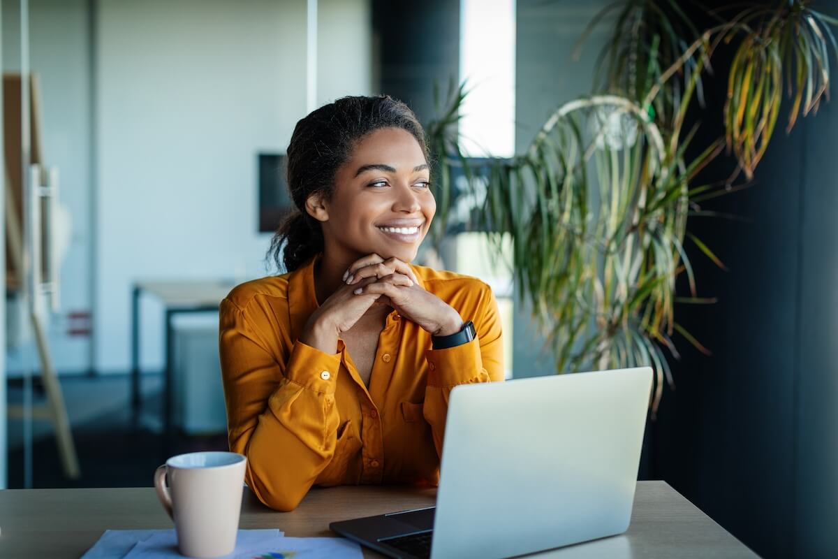 Employee smiling while looking away