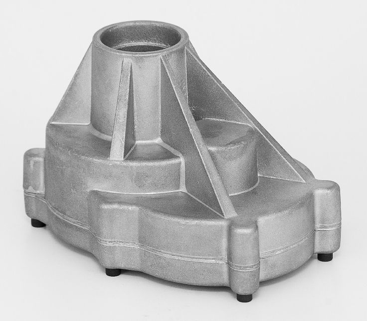 A die-cast aluminum part with ribs and an opening with two sections bolted together