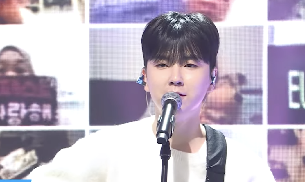 A photo of Kwon Eui Bin singing