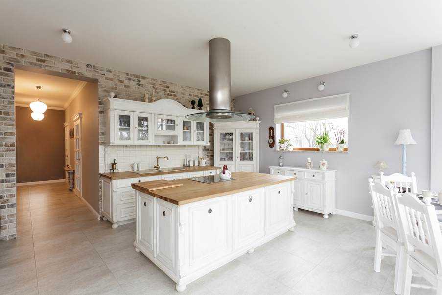 A kitchen with white cabinets and a large island

AI-generated content may be incorrect.