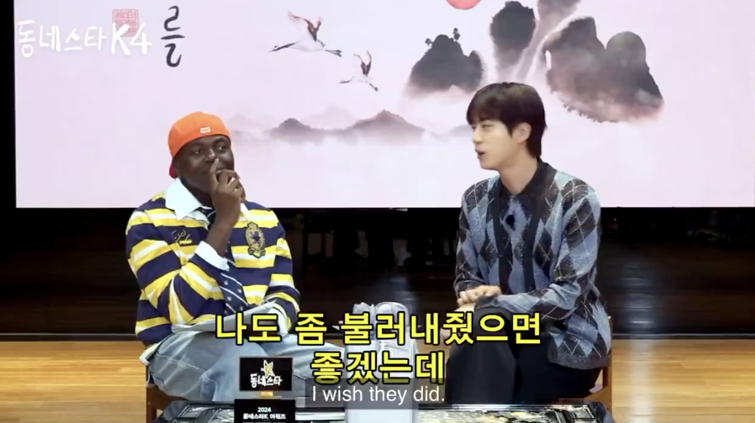 A picture of Jonathan and bst jin in a talk show 