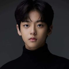 A photo of Ko Woo-rim wearing black turtle neck shirt 