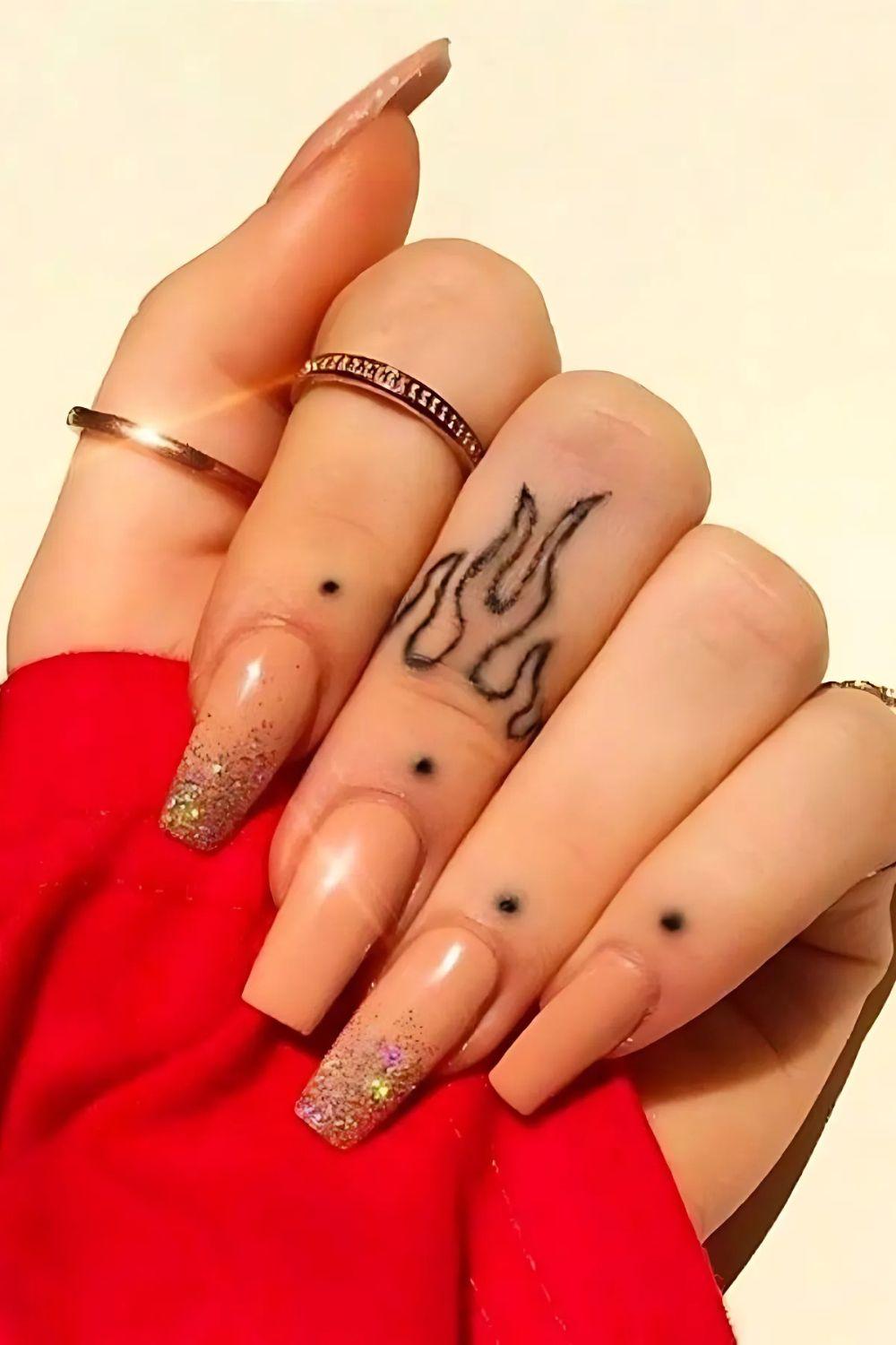 Flame Finger Tattoo