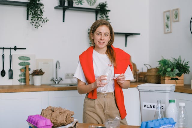 A person recycling plastic