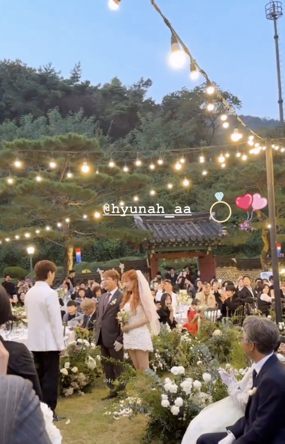 A photo of HyunA and Yong Junhyung on their wedding day