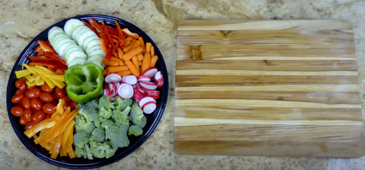 vegetable platter and a wooden chopping board