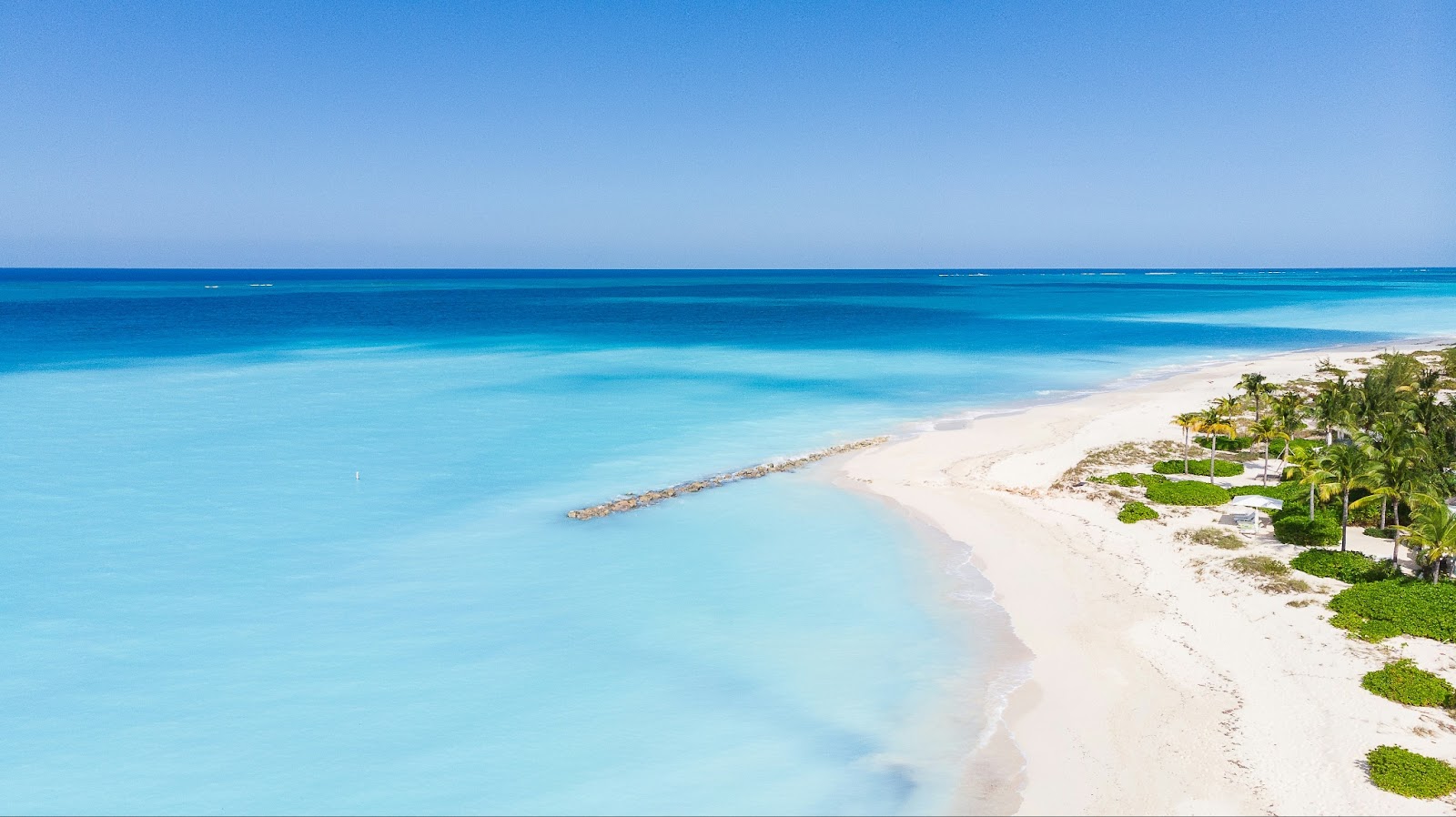 Grace Bay beach in Turks & Caicos, with clear blue water and soft sands.