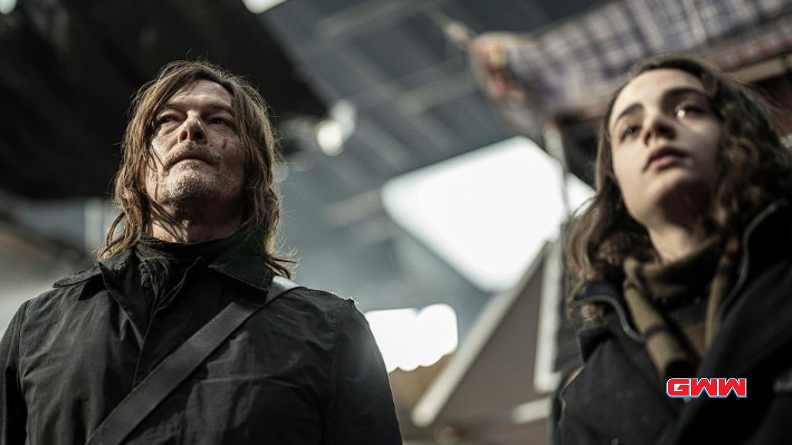 Norman Reedus as Daryl Dixon and Clémence Poésy as Isabelle walking