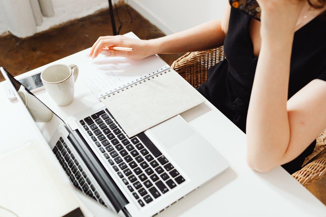 Free Woman Using a Laptop Stock Photo