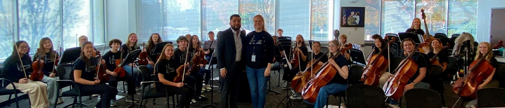 West Springfield High School Chamber ensemble performing at Gatehouse Administration Center, with Orchestra Director Alexandra Blaine and Region 4 Assistant Superintendent Pablo Resendiz in front. 