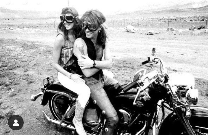 Romeo Jon Bongiovi's Parents, Jon Bon Jovi, and Dorothea Hurley on a motorcycle