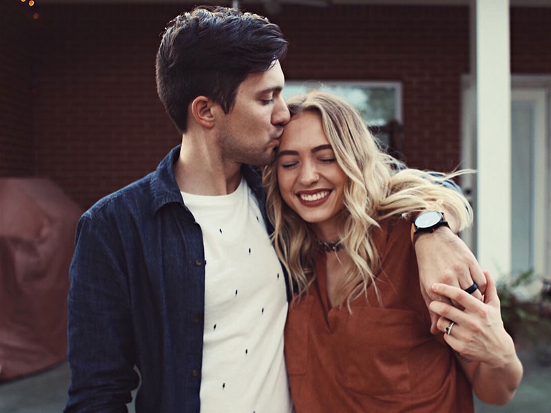 Two young couples, laughing and loving each other.