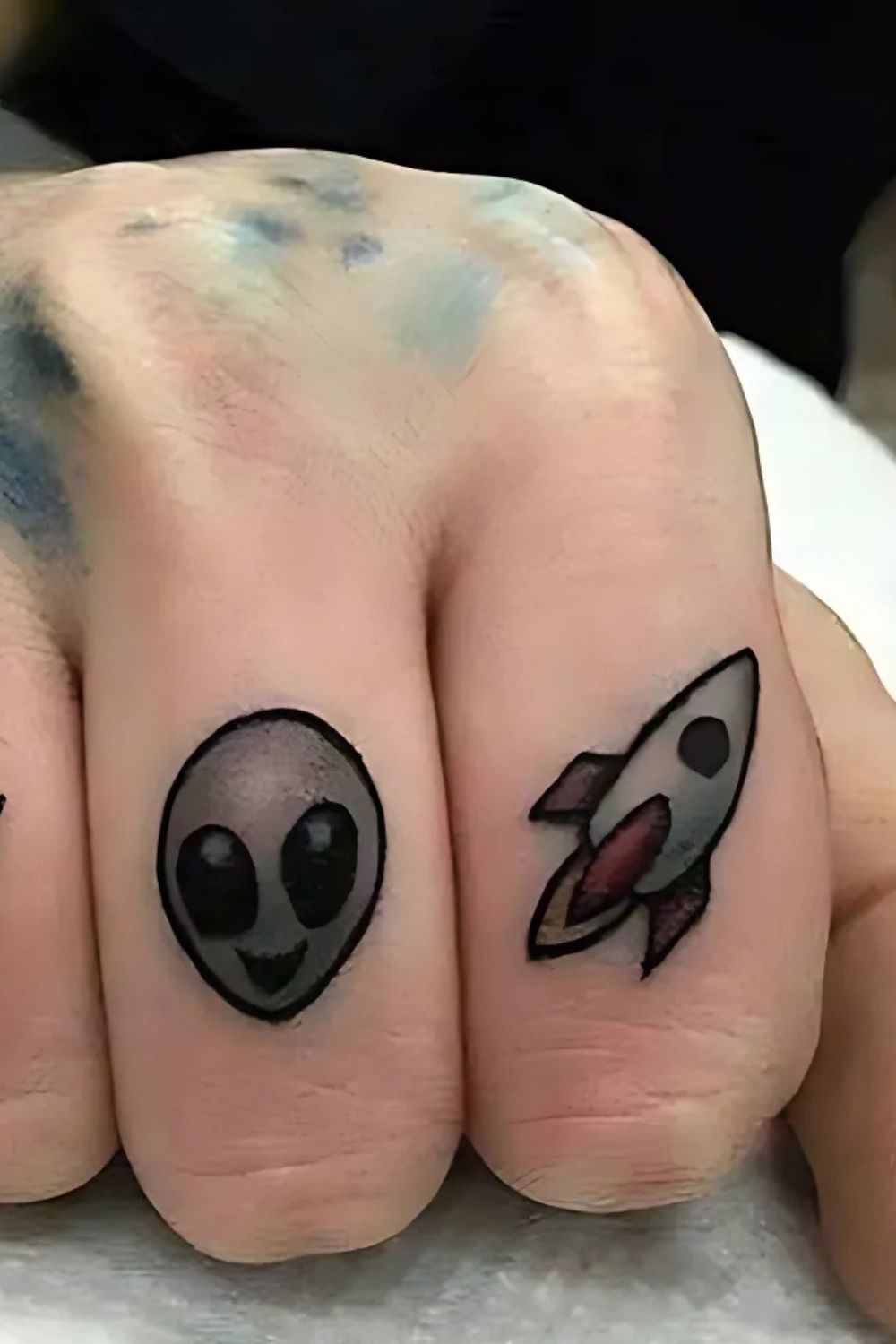 Alien Finger Tattoo