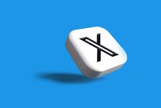 This contains an image of  a white dice with the letter x on it's side against a blue background