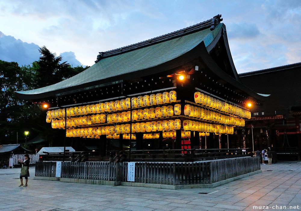 Yasaka Shrine Kyoto at night with hundreds of traditional paper lanterns creating dramatic illumination perfect for spiritual kimono photography