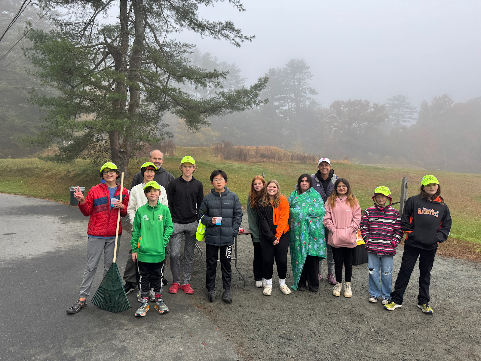 students and adults photographed outside