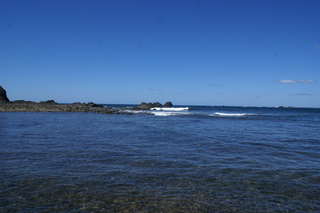 Clean and clear water and rocks at the border and sky is clear
