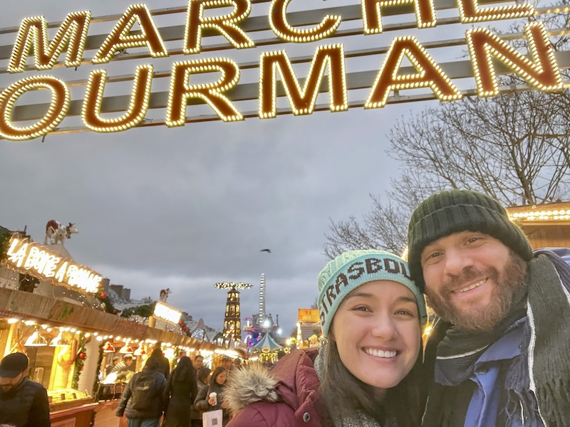 In front of the Christmas Market in Garden de Tuileries in Paris. 