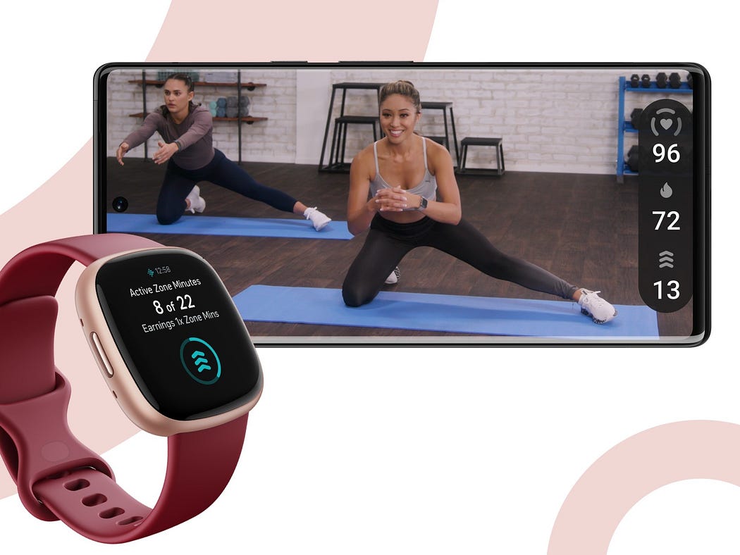 Women at the gym wearing Fitbit Versa 4 for tracking fitness activities.