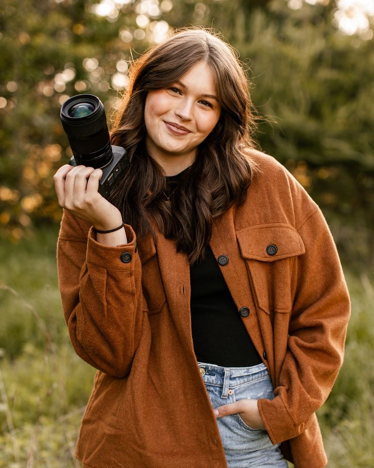 Wedding photographer beaming with joy, ready to capture stunning shots for the couple's big day.