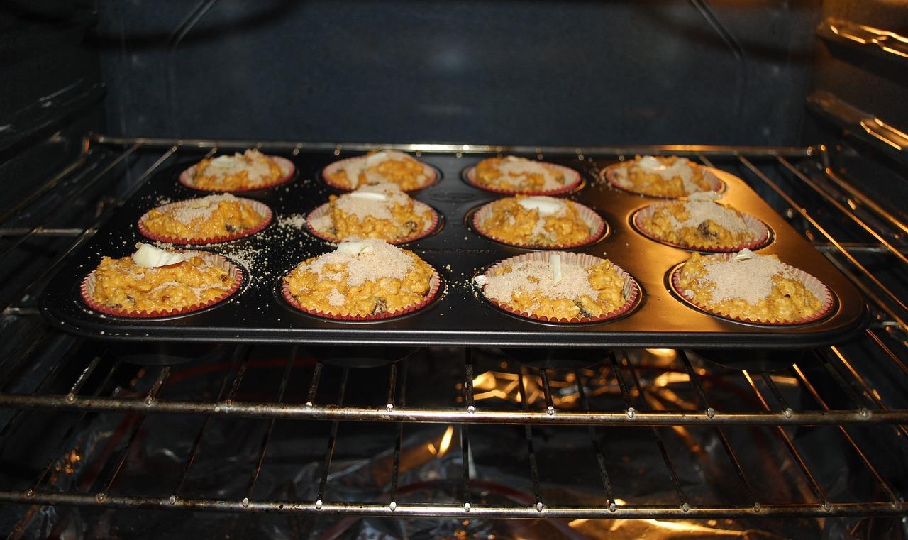 Muffins in an oven with the light on