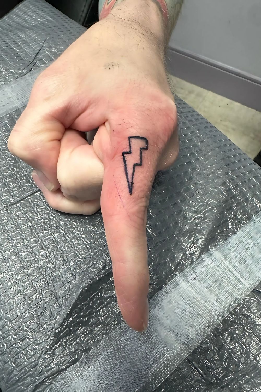 Lightning Bolt Finger Tattoo