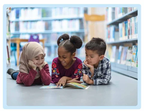 Children reading poetry and smiling