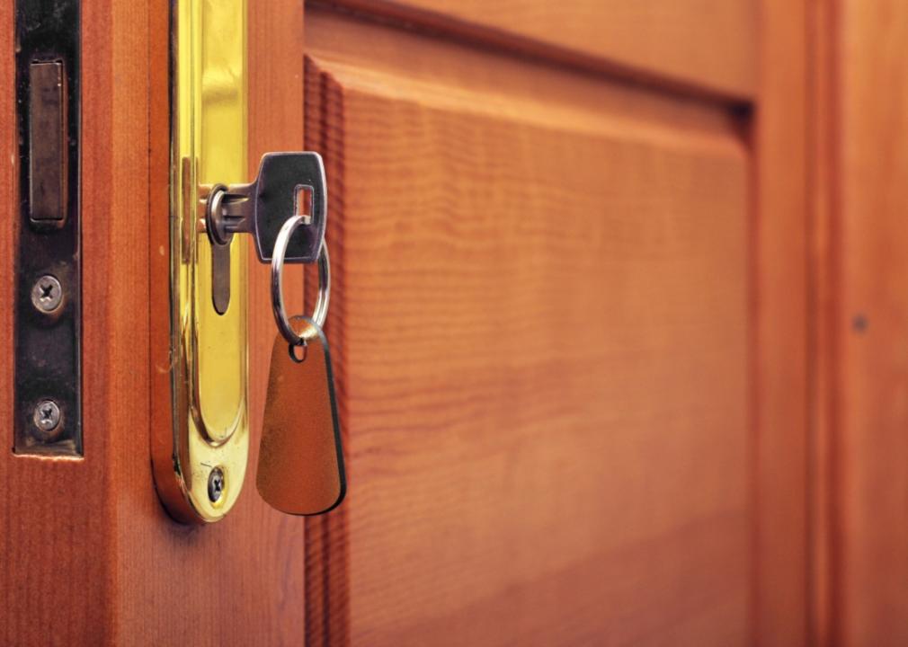 A front door with a key in the lock.