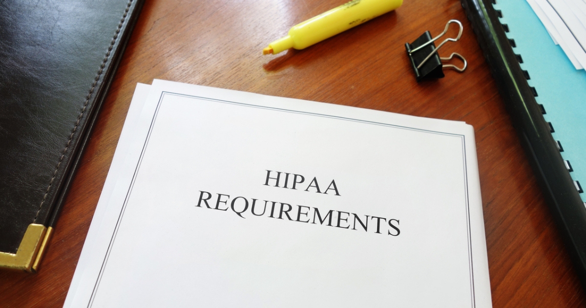  A document on a table about requirements for the Health Insurance Portability and Accountability Act (HIPAA).