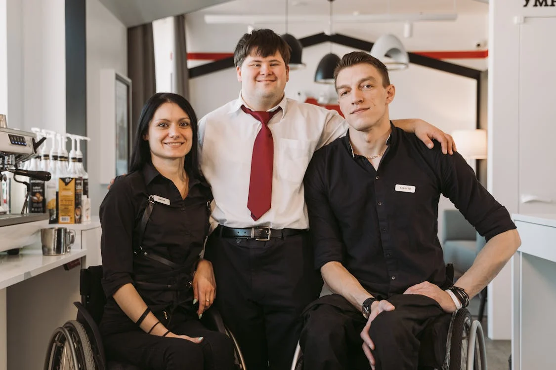 people with disabilities happily working in workspace