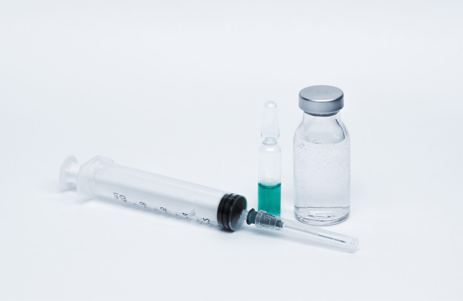 a-syringe-glass-ampoule-with-green-liquid-and-clear-vial-on-white-background-the-ovagen-detox-stack-that-hits-harder-than-any-cleanse-youve-tried-tony-huge
