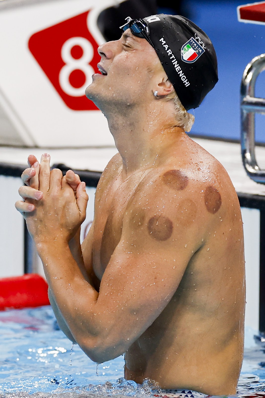 Nicolo Martinenghi of Italy clasps his hands during the Men's 100m Breaststroke Final at the Paris 2024 Olympic Games on July 28, 2024 | Source: Getty Images