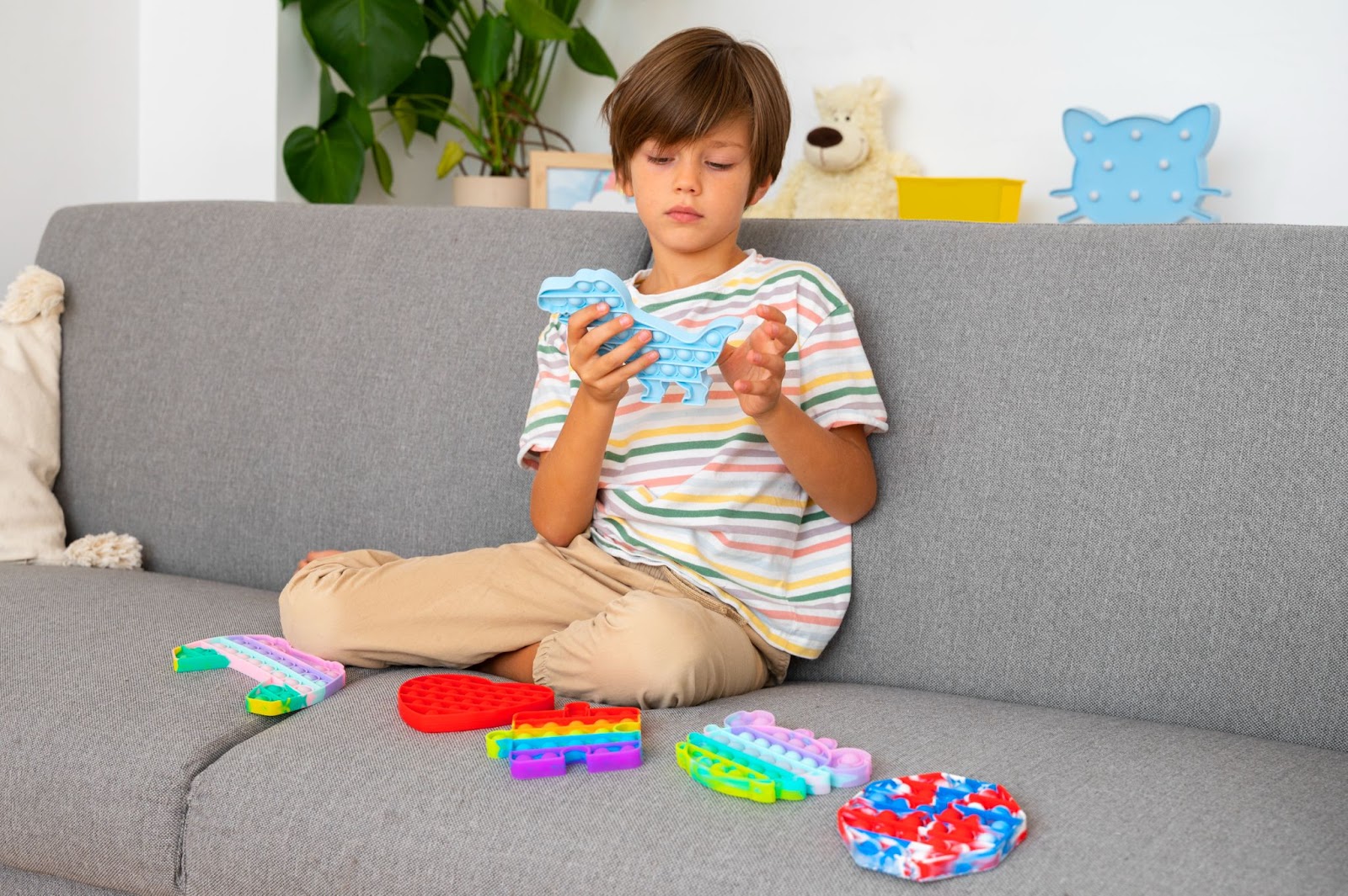 a kid playing bubble pop it
