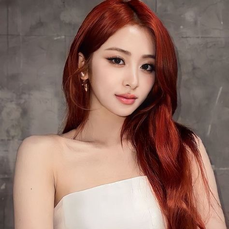 This contains an image of yunjin on a red color hair an a white dress