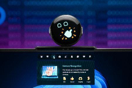 A round black device with a thumbs up on top of it

AI-generated content may be incorrect.