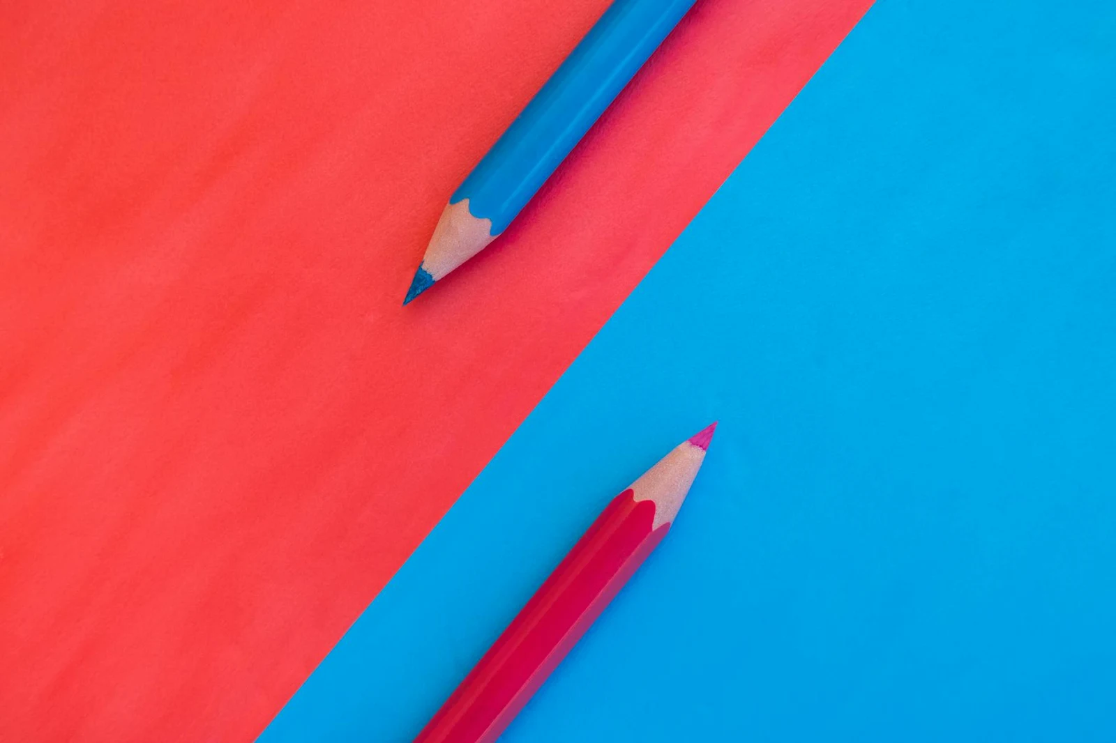 https://www.pexels.com/photo/pink-and-blue-background-divided-diagonally-with-two-matching-colored-pencils-placed-on-opposite-colors-top-down-view-flat-lay-with-empty-space-for-text-17151677/