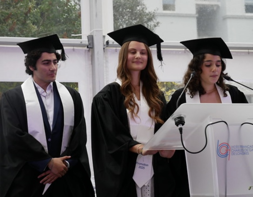 A group of people wearing graduation gowns and cap

Description automatically generated