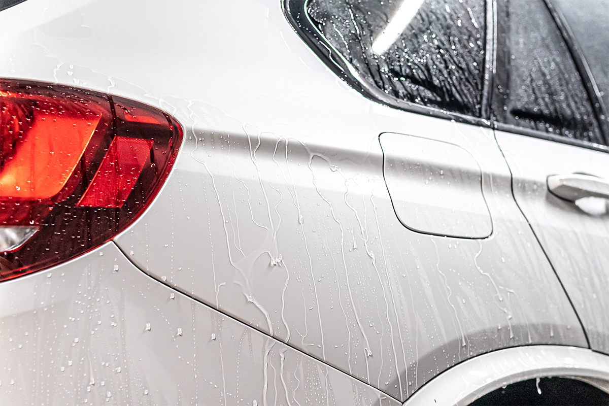 Car wax creates a hydrophobic layer over the car's painted surfaces