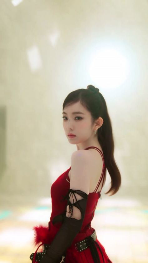 This contains an image of Irene on a red dress 