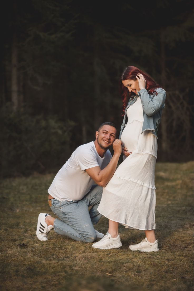 Expecting dad’s loving gesture: Trying to hear the baby in a heartwarming maternity shoot.